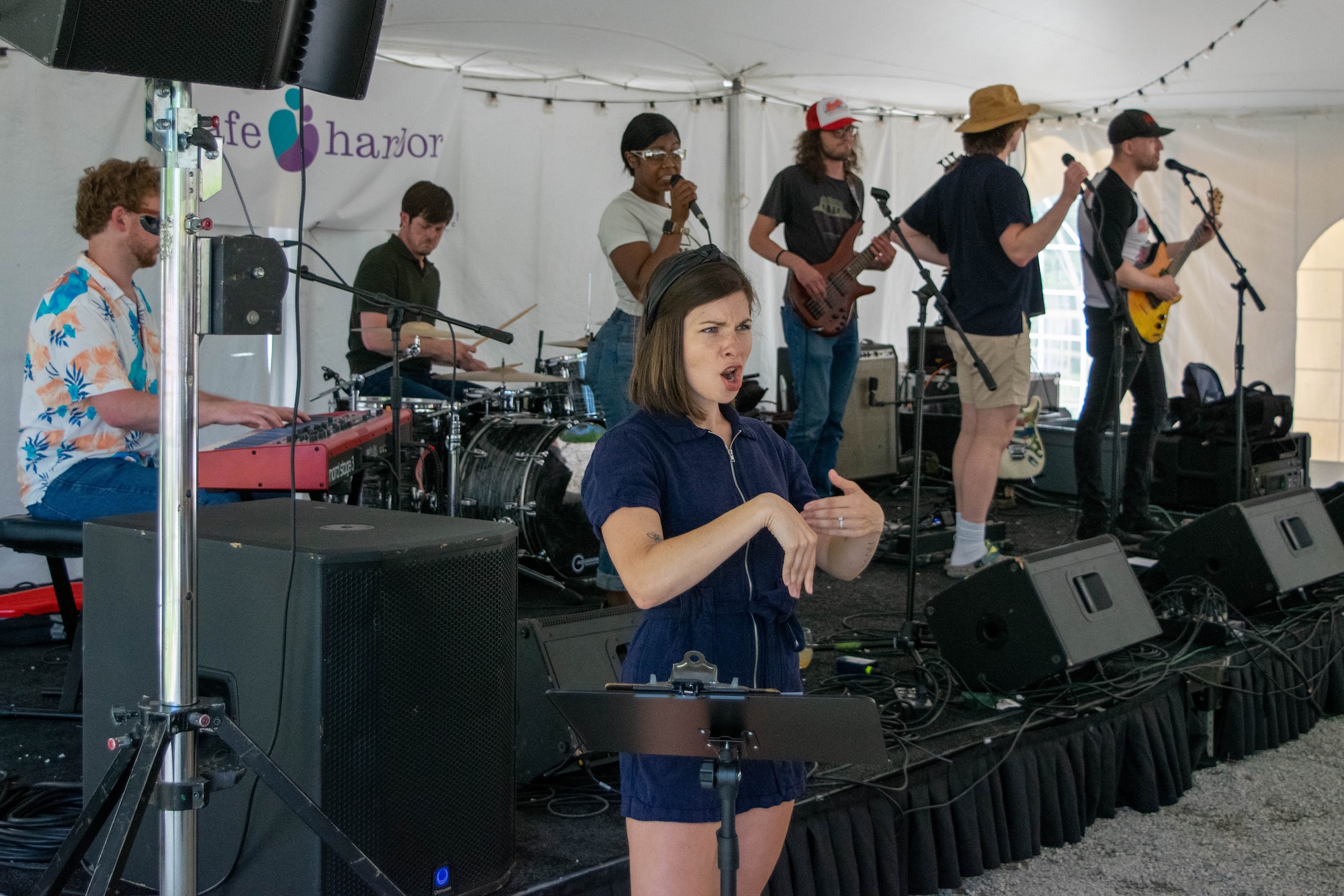 RVA Taco Festival 2026 - Band named The Party Favors performing with an ASL interpreter in the foreground